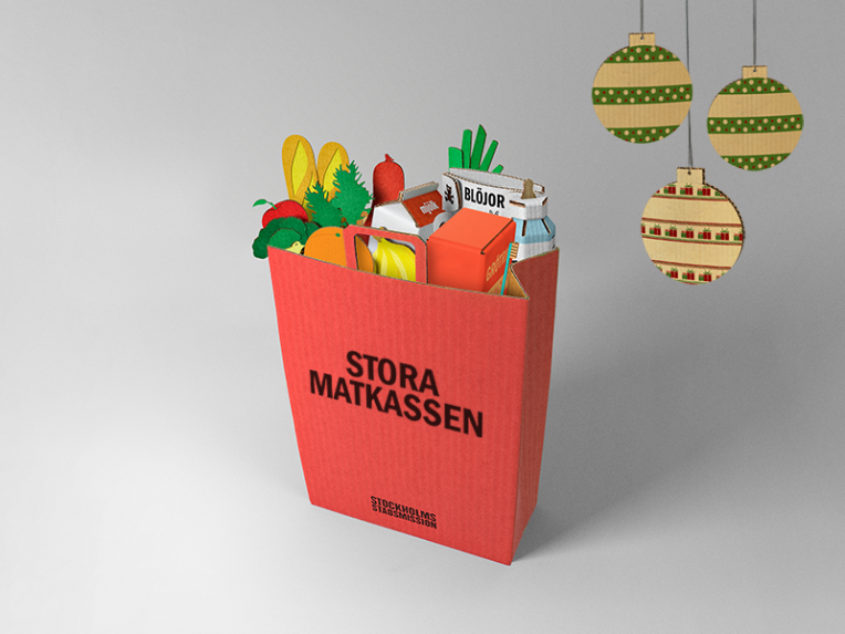Matkasse i kartong med matvaror.