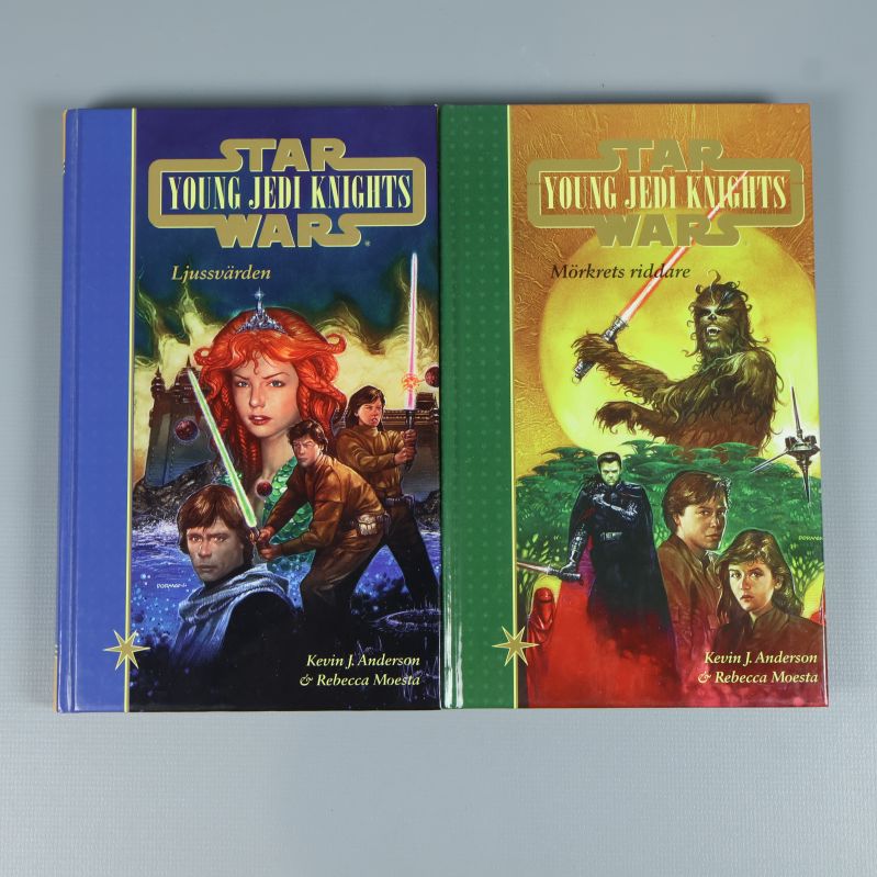 Två böcker Young Jedi Knights med illustrerade omslag, ljussablar och karaktärer
