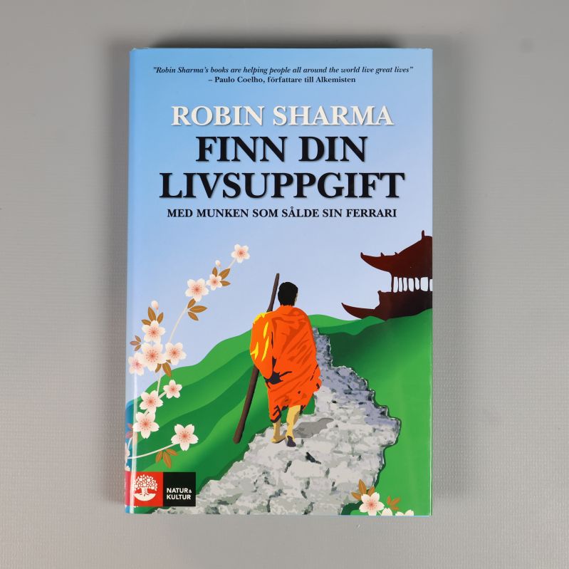 Framsidan av boken Finn din livsuppgift med färgstarkt omslag och munkmotiv