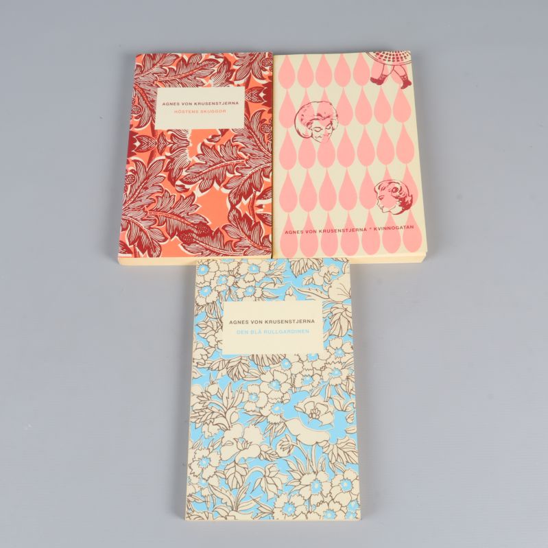 Tre böcker med färgglada omslag av Agnes von Krusenstjerna