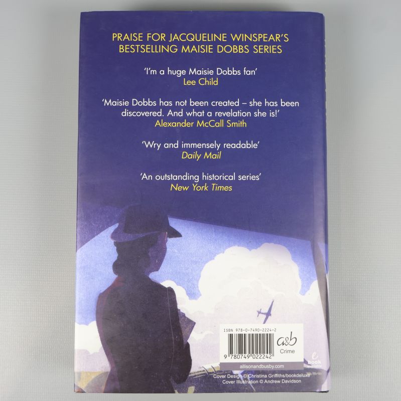 Baksida av boken To Die But Once med citat 