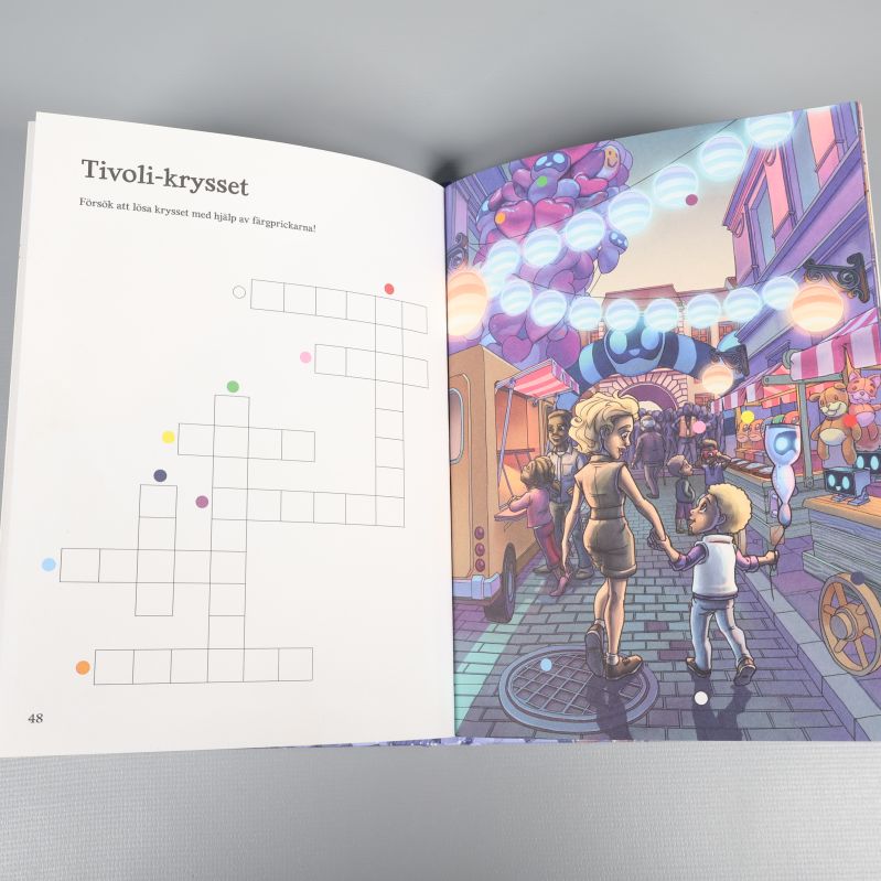 Uppslag i Handbok för superhjältar jullovsbok med tivolikryss och illustration