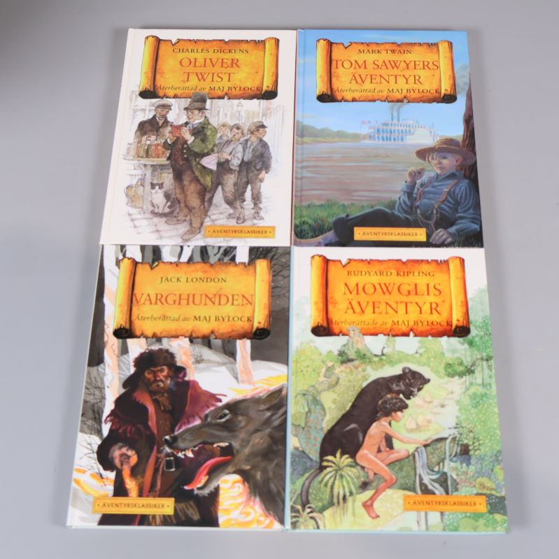 Fyra böcker: Oliver Twist, Tom Sawyers äventyr, Varghunden, Mowglis äventyr, alla med illustrerade omslag