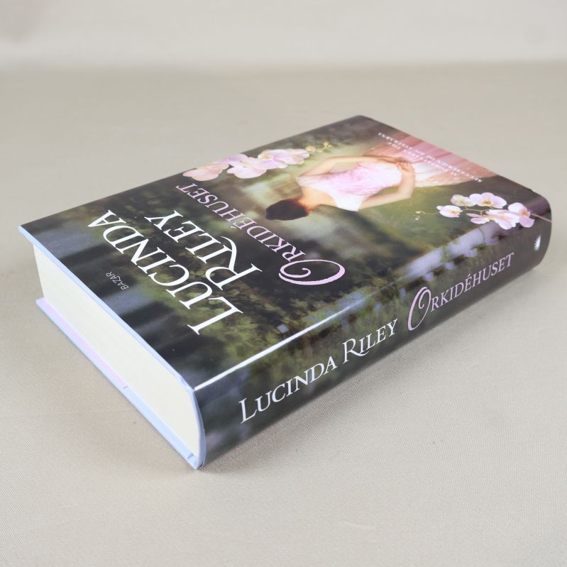 Orkidéhuset liggande med synlig tjock och inbunden pärm