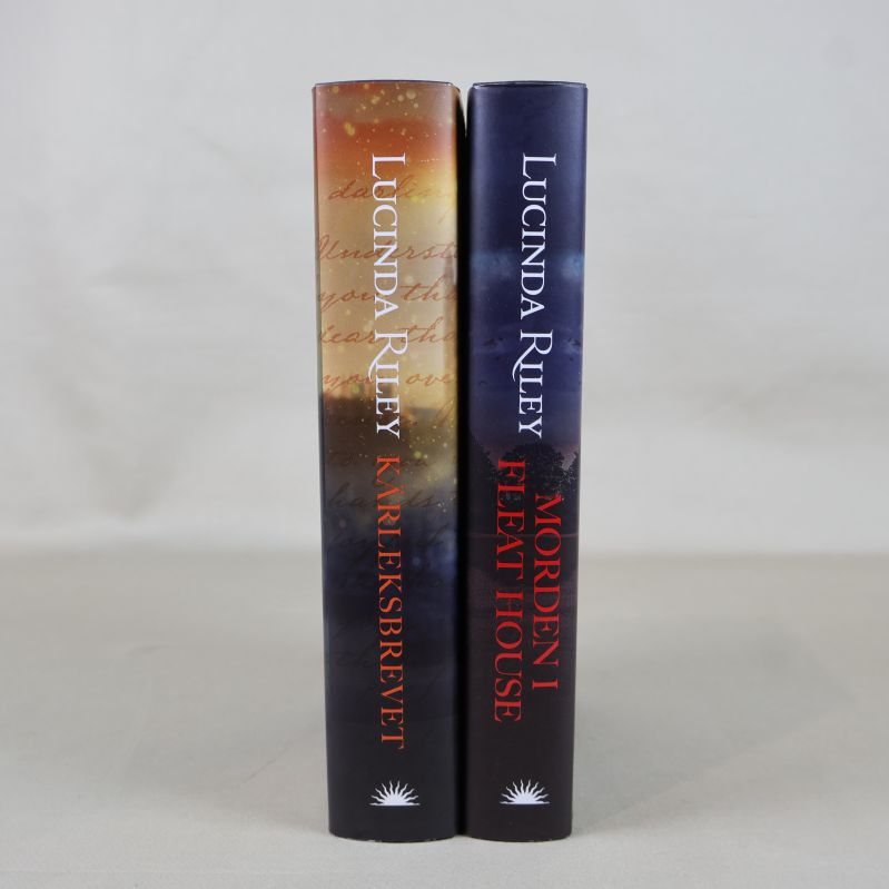 Ryggen på två inbundna böcker av Lucinda Riley
