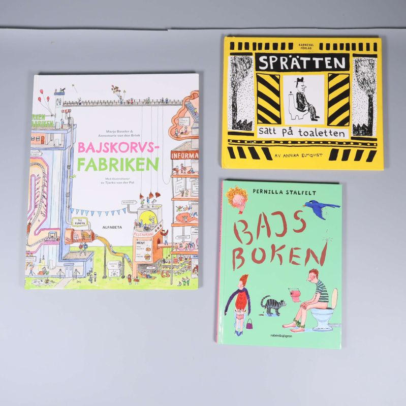 Tre barnböcker med färgglada omslag och tema bajs