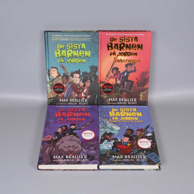 Fyra färgstarka böcker i serien De sista barnen på jorden, framsidor med tecknade karaktärer och monster