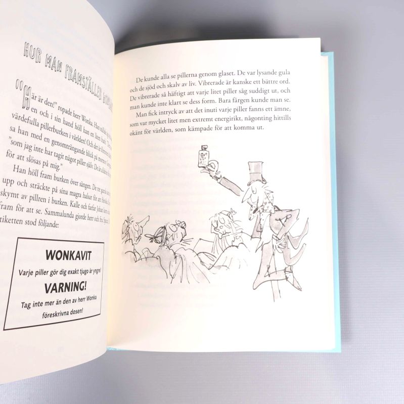 Uppslag ur Kalle och glashissen med illustration och text