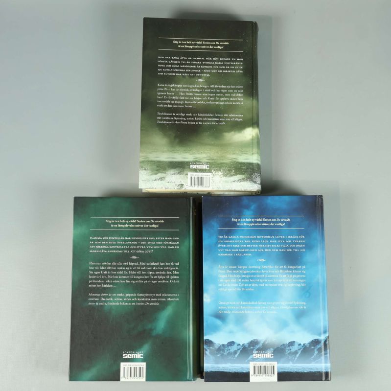 Baksidor på De utvalda böcker med text och logotyp