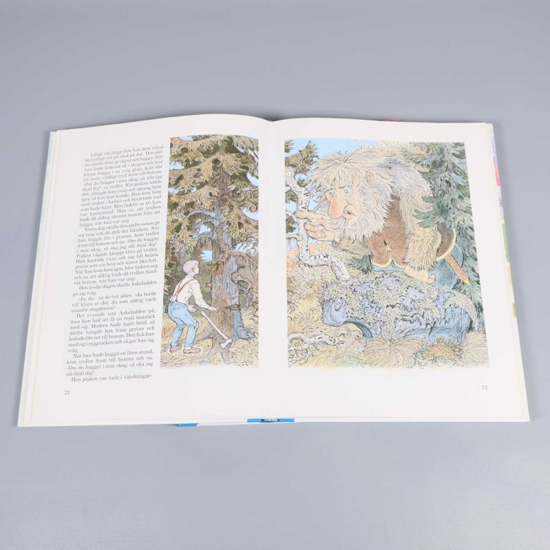 Uppslag ur Folksagor med färgillustrationer av troll och pojke i skogen