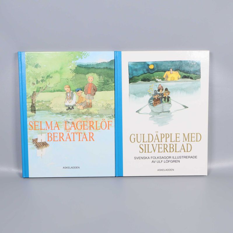 Två böcker med blå rygg: Selma Lagerlöf berättar och Guldäpple med silverblad