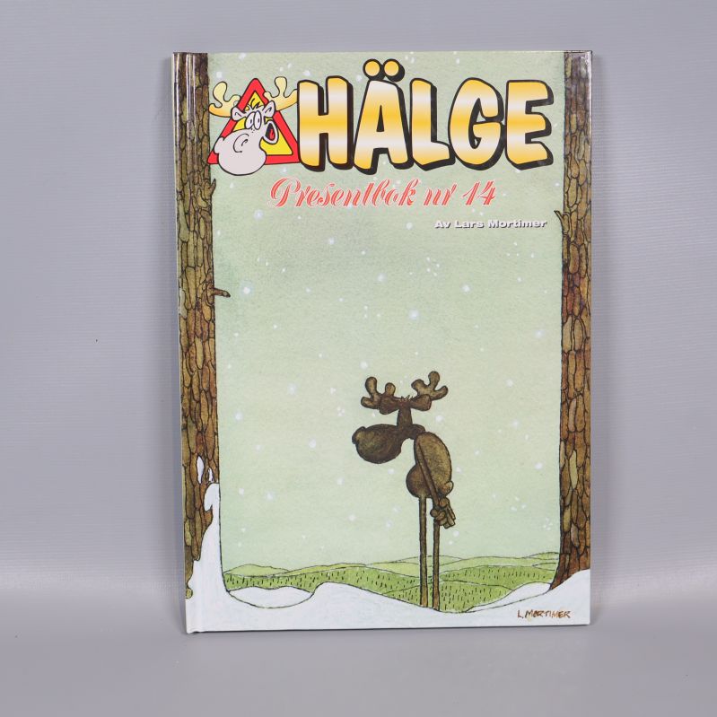 Framsidan av Hälge Presentbok nr 14 med tecknad älg i vinterlandskap