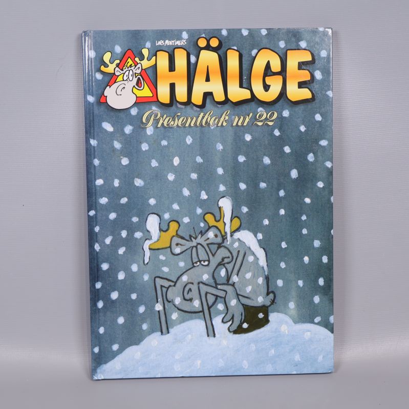 Framsida av Hälge presentbok nr 22 med snöig teckning