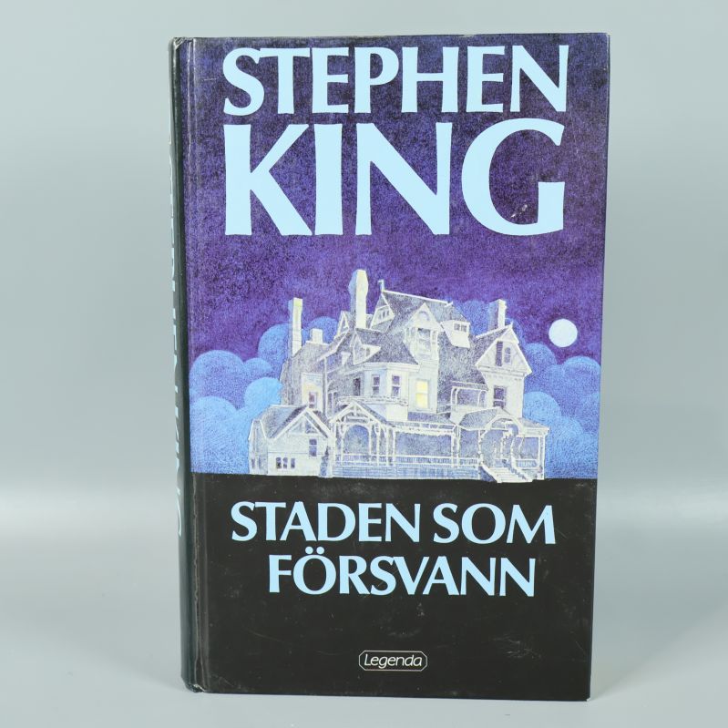 Framsida på boken Staden som försvann med illustration av hus