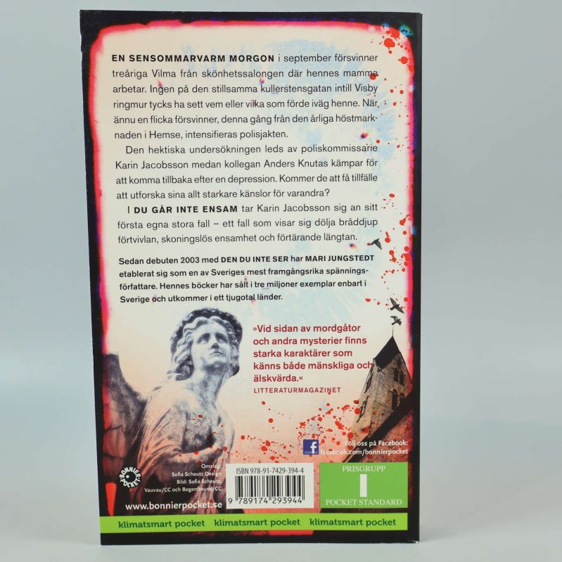 Baksida av Du går inte ensam med beskrivning och ISBN
