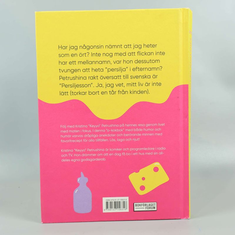 Baksida av Keyyo Mitt livs buffé med rosa och gul design samt beskrivande text