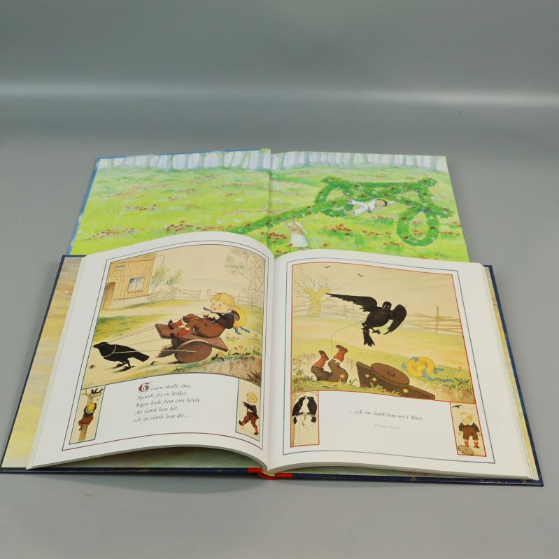 Uppslagen bok från Min skattkammare visar färgglada illustrationer och text