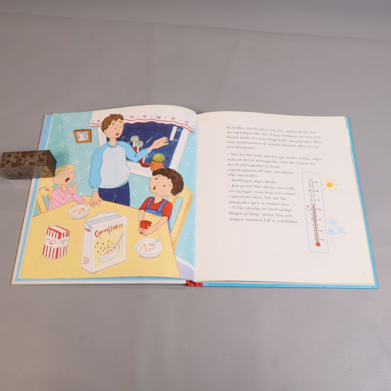 Illustrerad inlaga med barn vid frukostbordet ur Kråke-boken