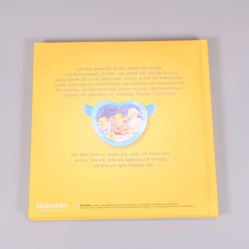 Baksida av barnbok med text om Alf och Bett och illustration i hjärta