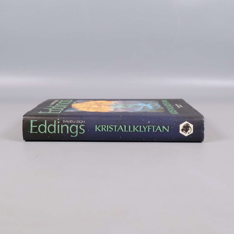 Bokrygg med titeln Kristallklyftan och författarnamn Eddings