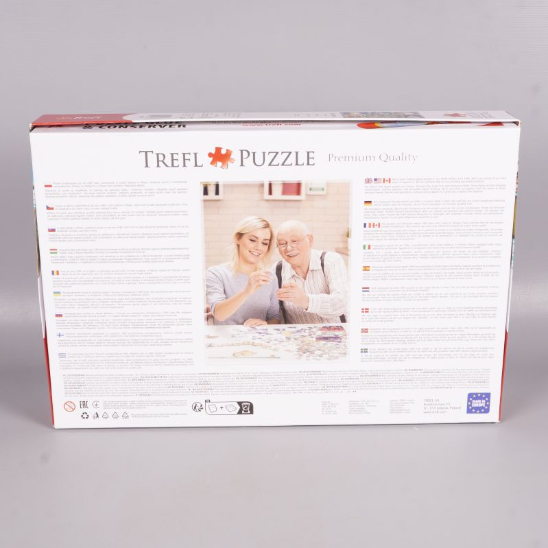 Baksida av Trefl pusselask med text och bild på personer som pusslar