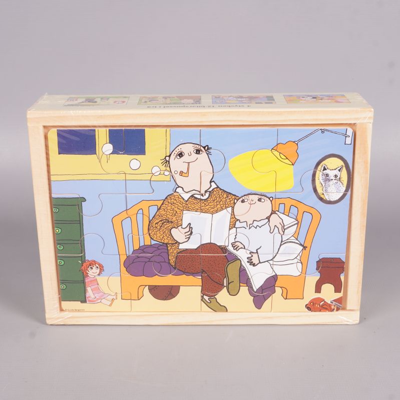 Alfons Åberg pussel sammansatt i öppen trälåda