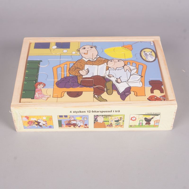 Fyra Alfons Åberg pussel i trälåda med motivsidor