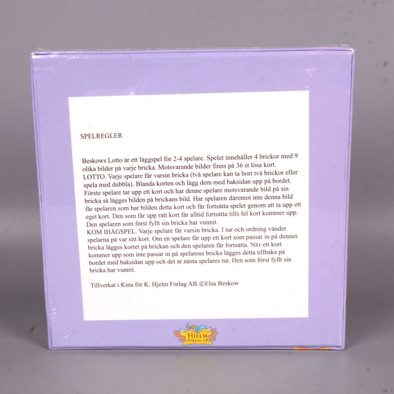 Baksida av lottospelets låda med detaljerad spelbeskrivning