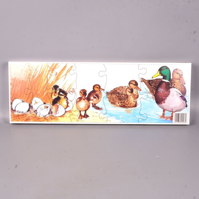 Färdiglagt träpussel med ankmotiv och strand