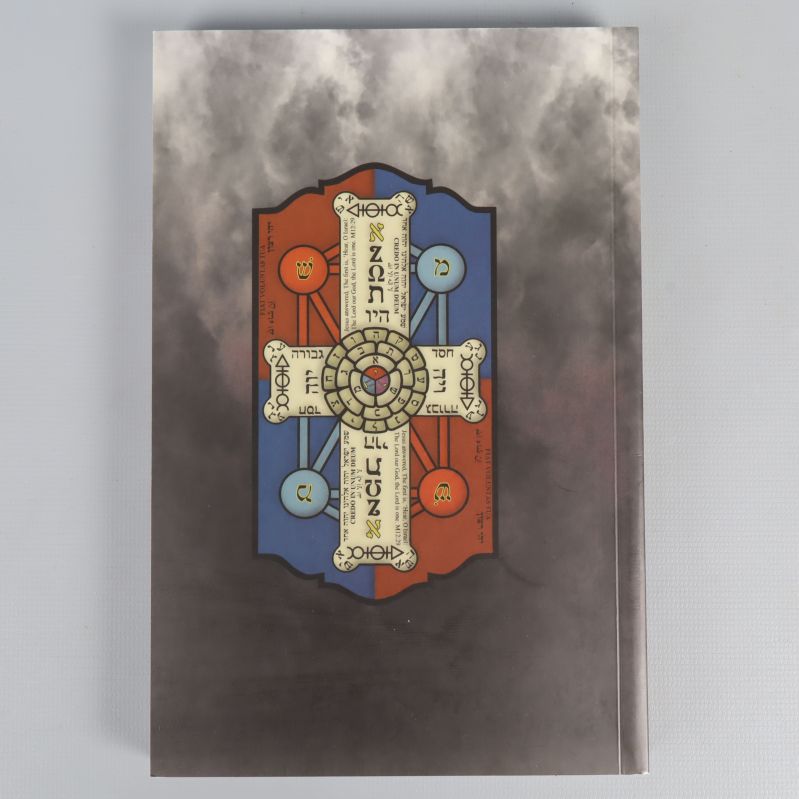 Baksidan av tarotkorten och guideboken med symbolmotiv