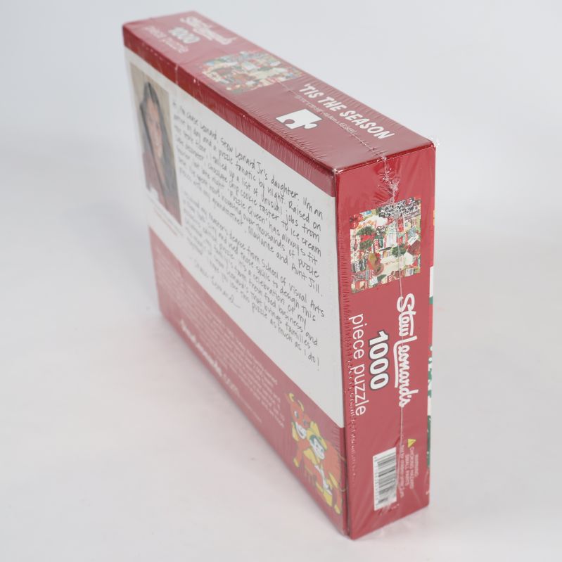 Baksidan och sidan på julpussel i röd kartong