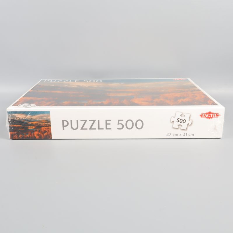 Pusselasken liggandes, visar Puzzle 500-trycket