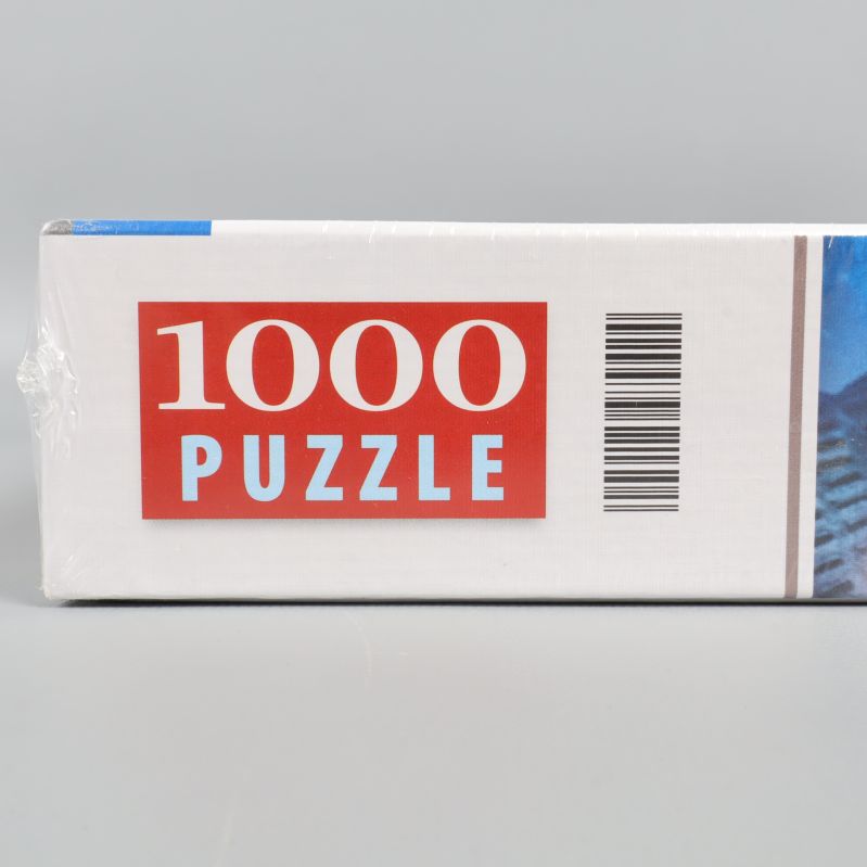 Närbild på texten 1000 pusselbitar på asken