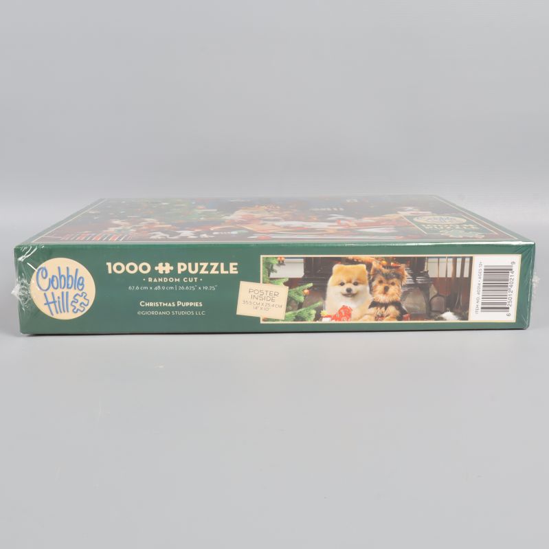 Sidan av Cobble Hill pussellåda med motiv och logotyp