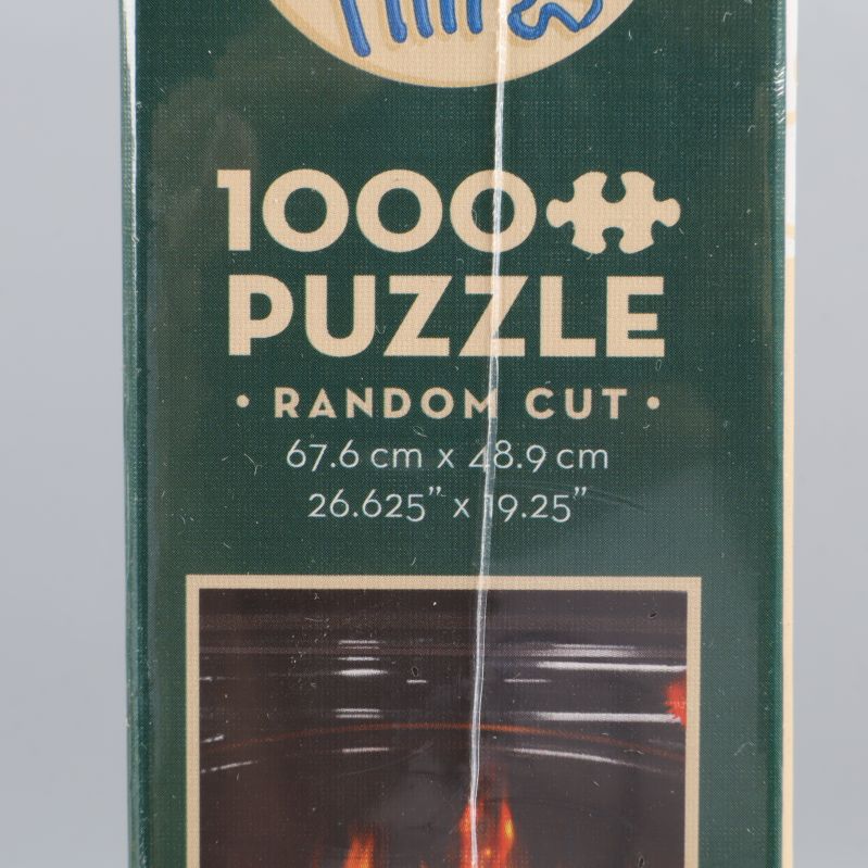 Närbild av pussellåda med måttangivelse och Cobble Hill logotyp