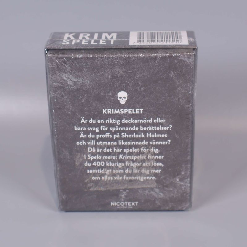 Baksidan av spellådan Krimspelet med beskrivning