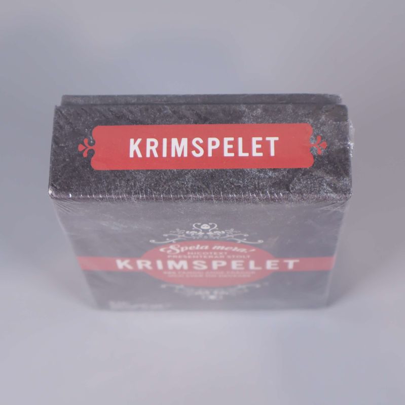 Ovansidan av Krimspelet med röd etikett och logotyp