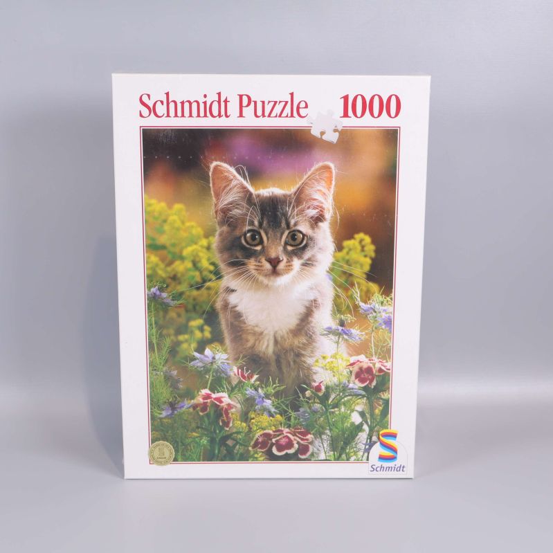 Pussellåda med kattmotiv och texten Schmidt Puzzle 1000