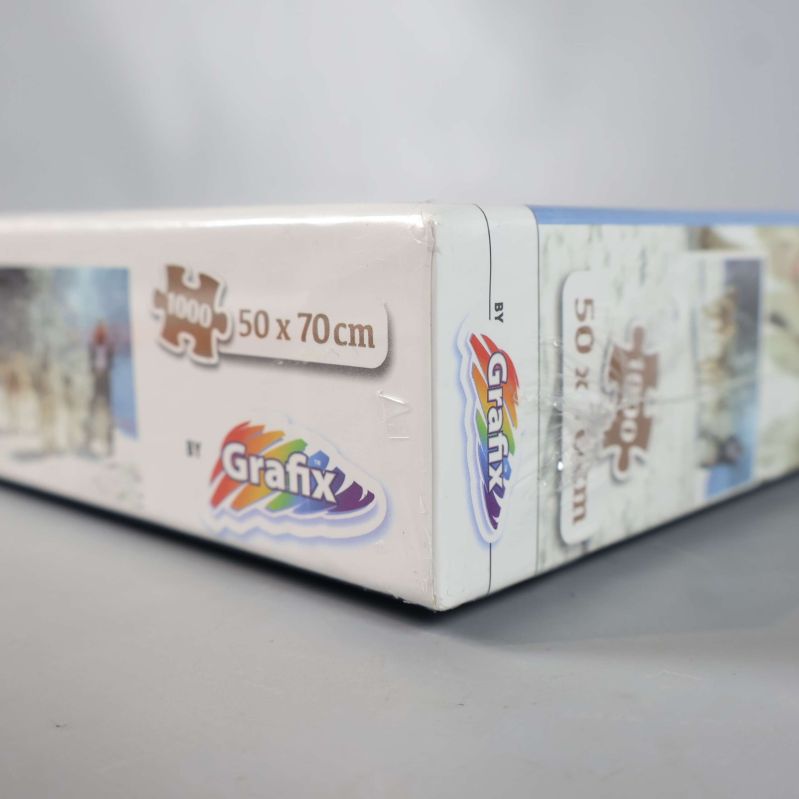 Närbild på hörnet av pusselask med Grafix-logotyp