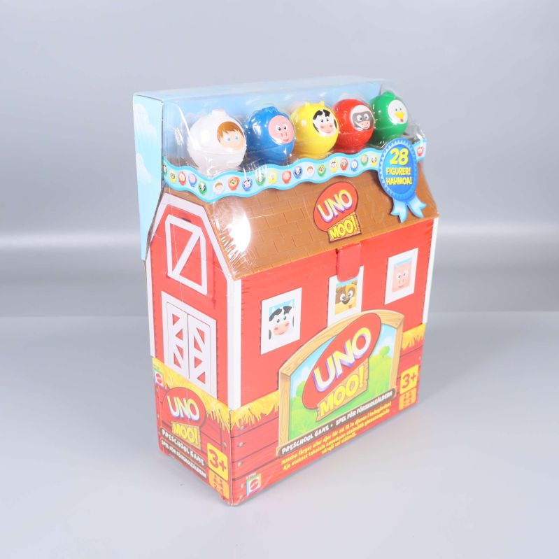 UNO Moo-spelet i förpackning med djurfigurer syns från sidan