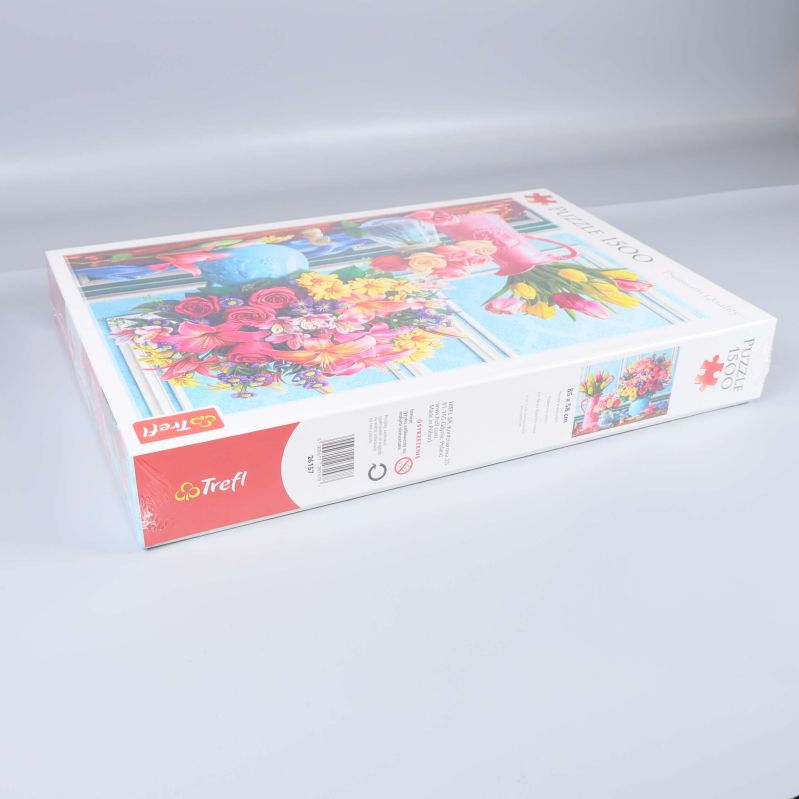 Pusselasken från sidan som visar Trefl-logga och pusselmotiv