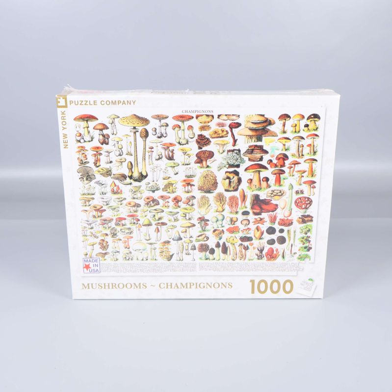 Framsida av pusselask med svampar och 1000 bitar markerat