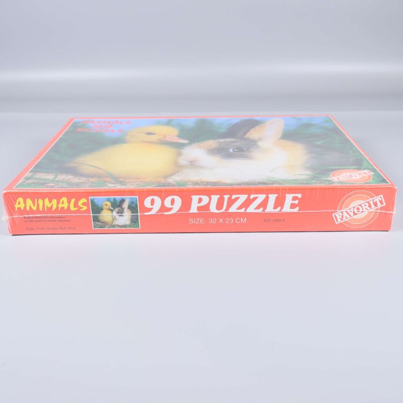 Pusselaskens sida med text och djurmotiv