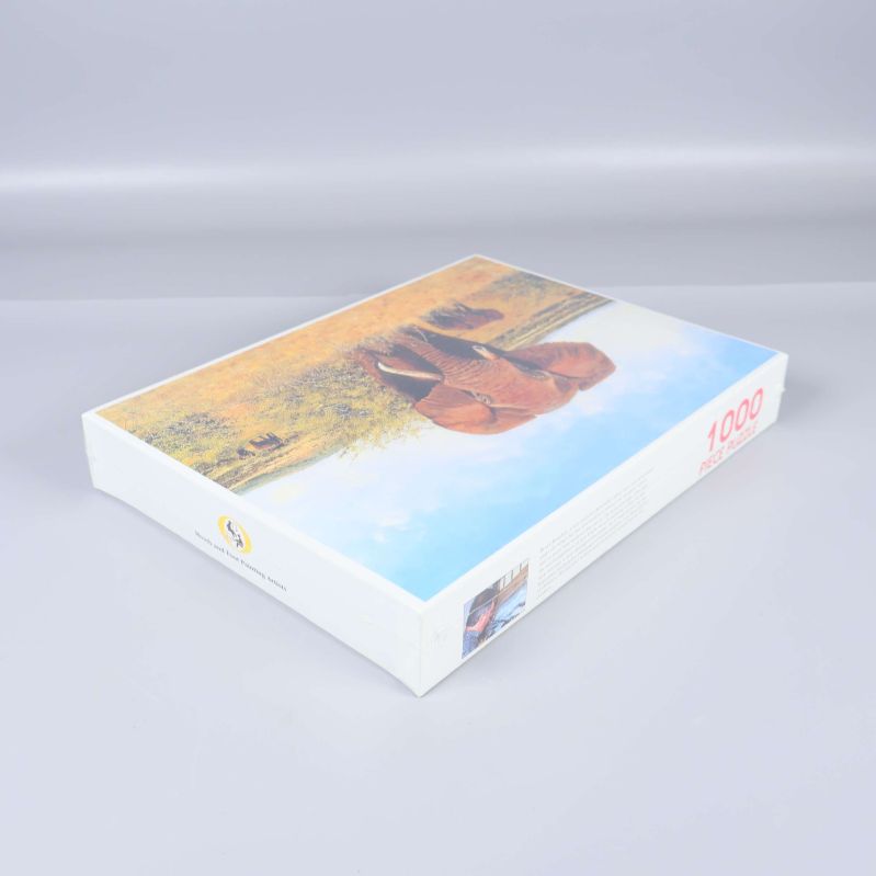 Perspektivvy av pussellådan med motivet synligt och 1000 piece puzzle-text