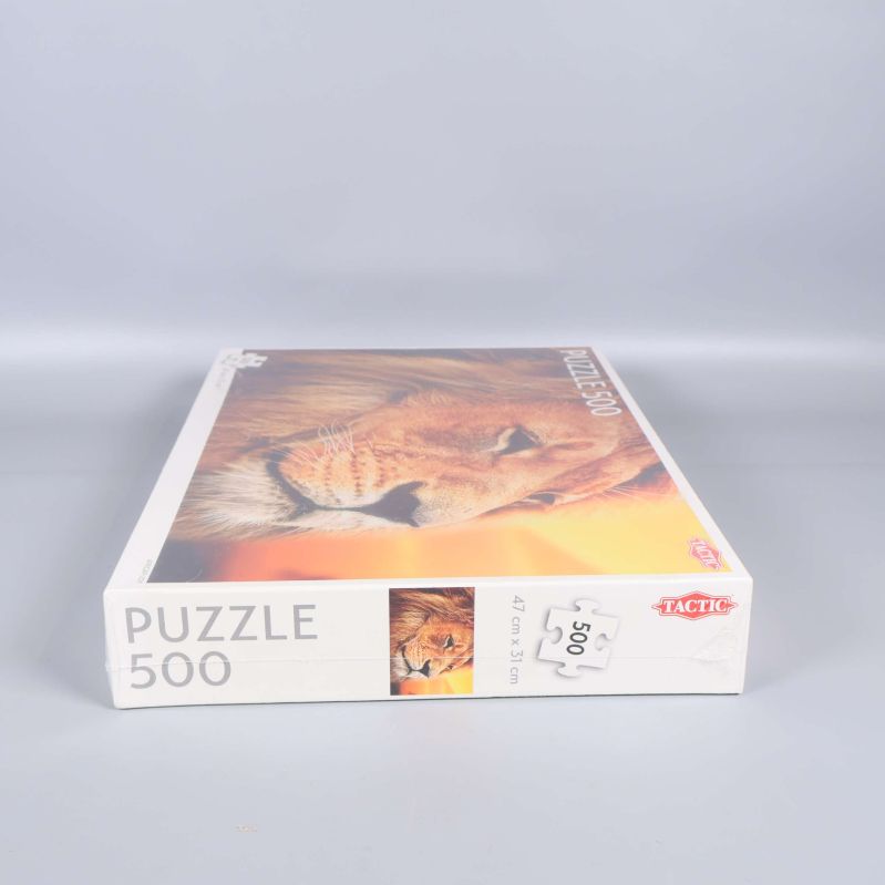 Kort sida av pussellåda med lejonmotiv och 500 bitar