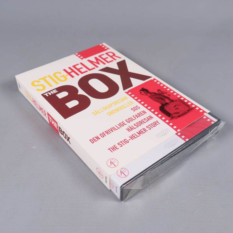 Stig-Helmer box från sida med plastomslag på grå bakgrund