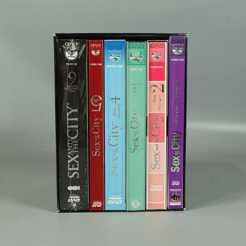 Öppen Sex and the City DVD-box med sex färgglada dvd-fodral