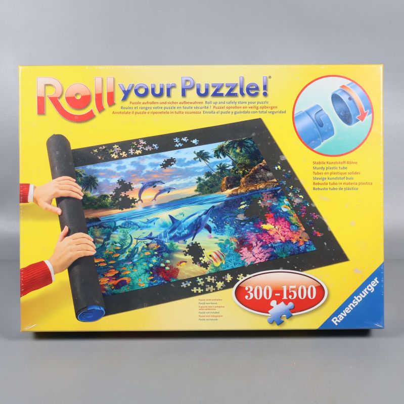 Framsida av Ravensburger pusselmatta i gul förpackning