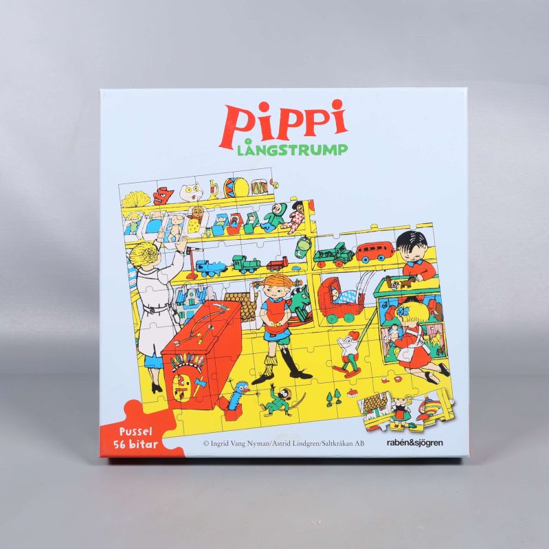 Framsidan av pussellåda med Pippi Långstrump och gult motiv