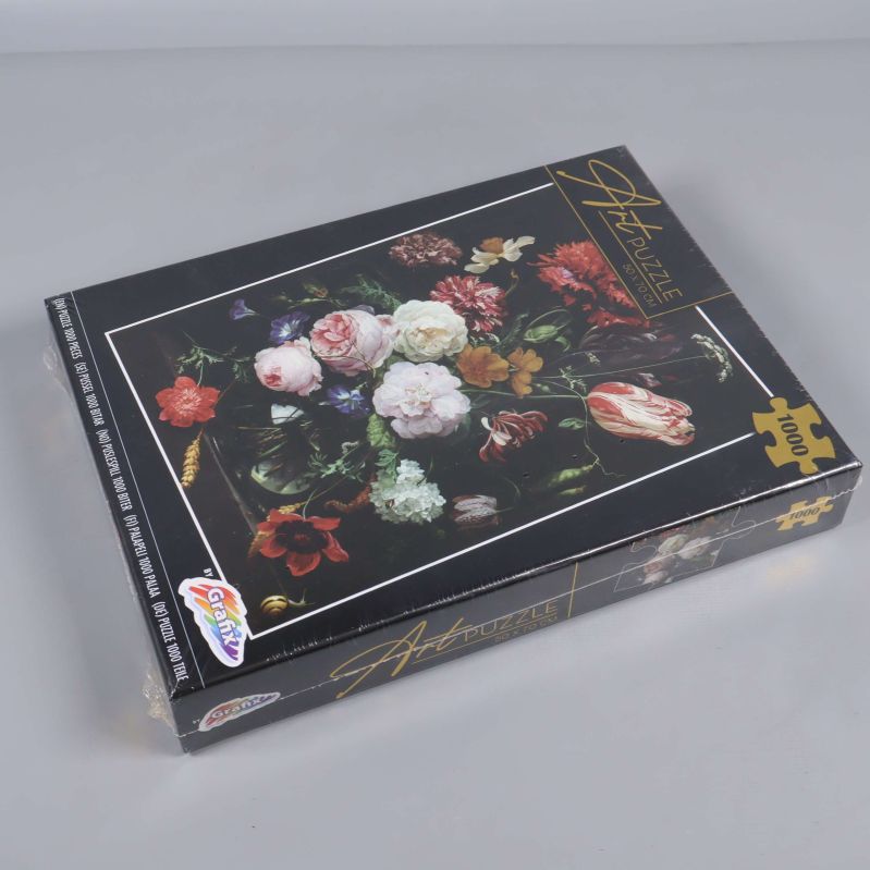 Art Puzzle-låda visad från sidan med tydligt blomstermotiv